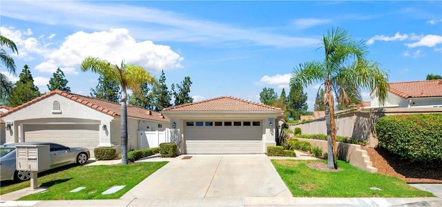 40633 Corte Albara, Murrieta, CA 92562 - view of front of house with a garage, stucco siding, a tiled roof, and driveway