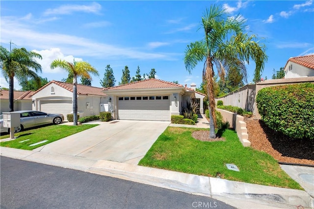 40633 Corte Albara, Murrieta, CA 92562 - mediterranean / spanish-style home featuring driveway, a tiled roof, stucco siding, an attached garage, and a front lawn