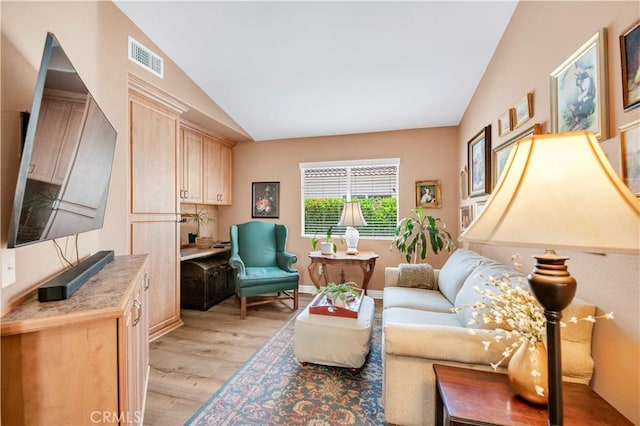 40633 Corte Albara, Murrieta, CA 92562 - living area featuring vaulted ceiling and light wood-type flooring