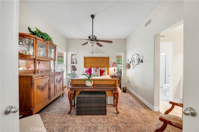 40633 Corte Albara, Murrieta, CA 92562 - bedroom with multiple windows, light wood-style flooring, and ensuite bathroom