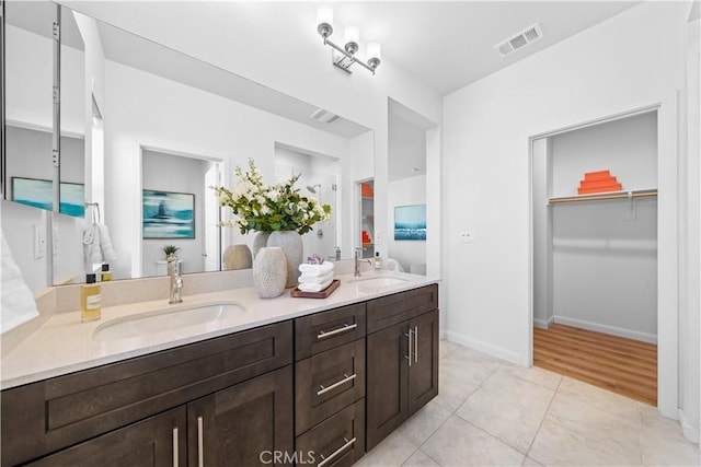 536 Cultivate, Irvine, CA 92618 - full bath with double vanity, a spacious closet, and tile patterned floors
