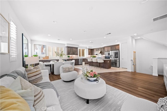 536 Cultivate, Irvine, CA 92618 - living area featuring recessed lighting and light wood-type flooring