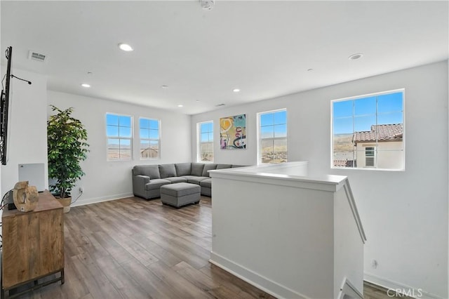 3969 Eliopulos Ranch Dr, Palmdale, CA 93551 - living room featuring wood finished floors and recessed lighting