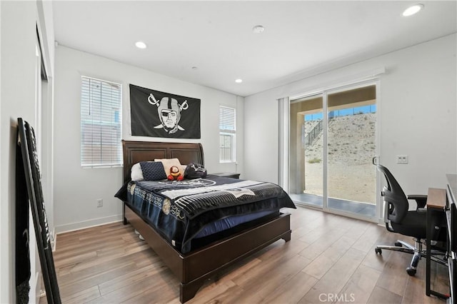 3969 Eliopulos Ranch Dr, Palmdale, CA 93551 - bedroom featuring access to exterior, wood finished floors, recessed lighting, and an office area