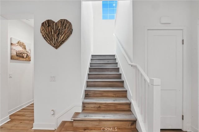 3969 Eliopulos Ranch Dr, Palmdale, CA 93551 - stairs featuring wood finished floors and baseboards
