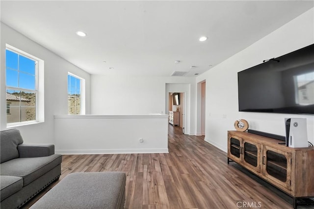 3969 Eliopulos Ranch Dr, Palmdale, CA 93551 - living room featuring wood finished floors and recessed lighting