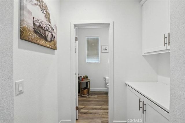 3969 Eliopulos Ranch Dr, Palmdale, CA 93551 - laundry room with wood finished floors