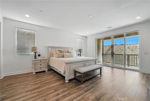 3969 Eliopulos Ranch Dr, Palmdale, CA 93551 - bedroom with access to exterior, wood finished floors, and recessed lighting