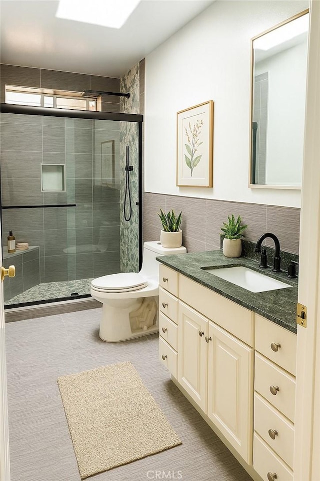 4215 Portola Ave, Los Angeles, CA 90032 - bathroom with vanity, a stall shower, and tile walls