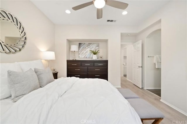 94 New Season, Irvine, CA 92602 - bedroom featuring light wood-style floors, recessed lighting, a ceiling fan, and arched walkways