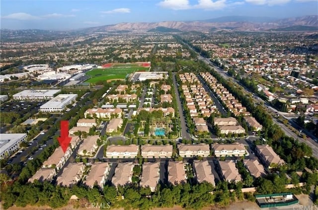 94 New Season, Irvine, CA 92602 - aerial view of property's location with nearby suburban area and a mountainous background