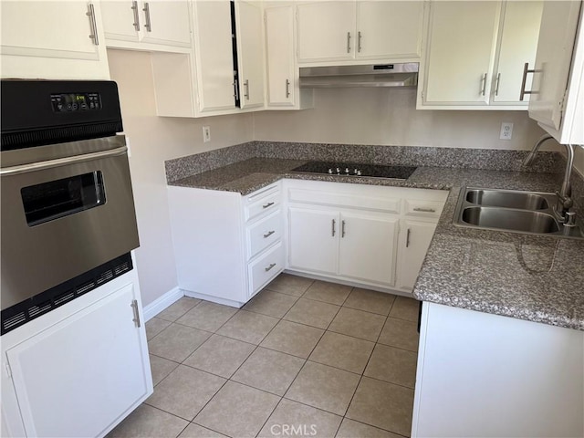 1218 Pine St, South Pasadena, CA 91030 - kitchen featuring under cabinet range hood, stainless steel oven, black electric cooktop, light tile patterned flooring, and white cabinets