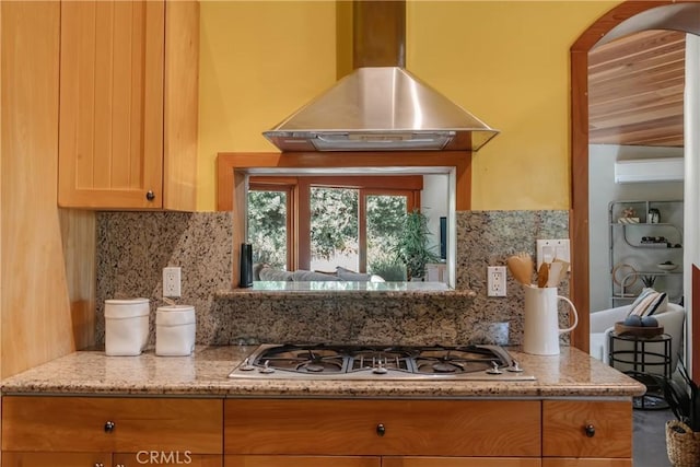 2 Chuckwagon Rd, Rolling Hills, CA 90274 - kitchen featuring exhaust hood, stainless steel gas stovetop, backsplash, and light stone counters