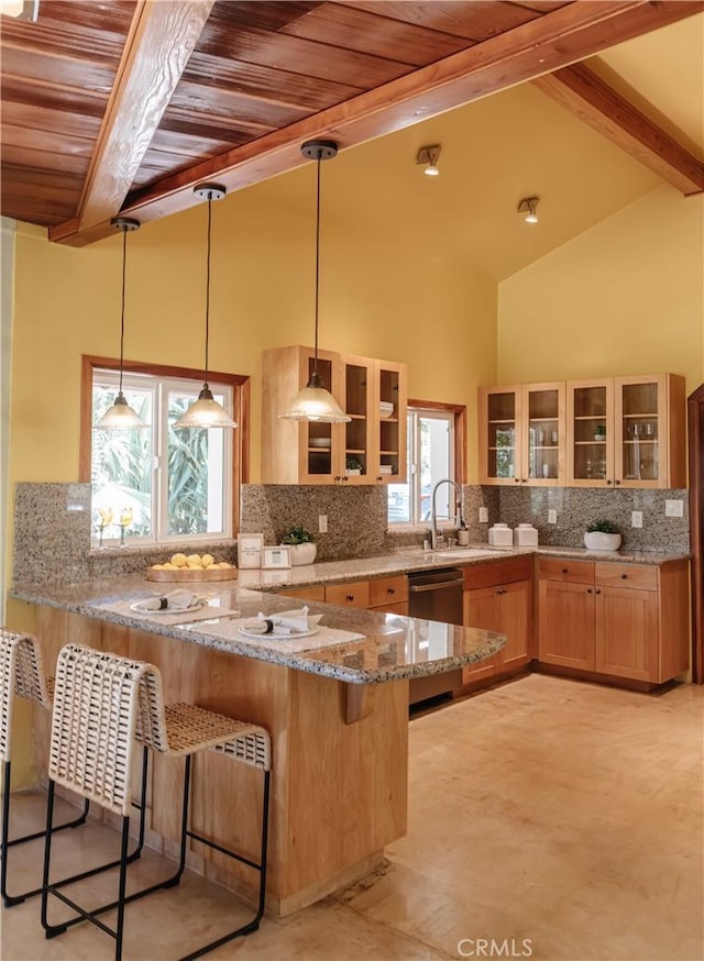 2 Chuckwagon Rd, Rolling Hills, CA 90274 - kitchen with stainless steel dishwasher, a wooden ceiling with exposed beams, a kitchen breakfast bar, light stone countertops, and a peninsula
