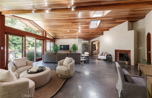 2 Chuckwagon Rd, Rolling Hills, CA 90274 - living area featuring concrete flooring, arched walkways, a brick fireplace, wooden ceiling, and high vaulted ceiling