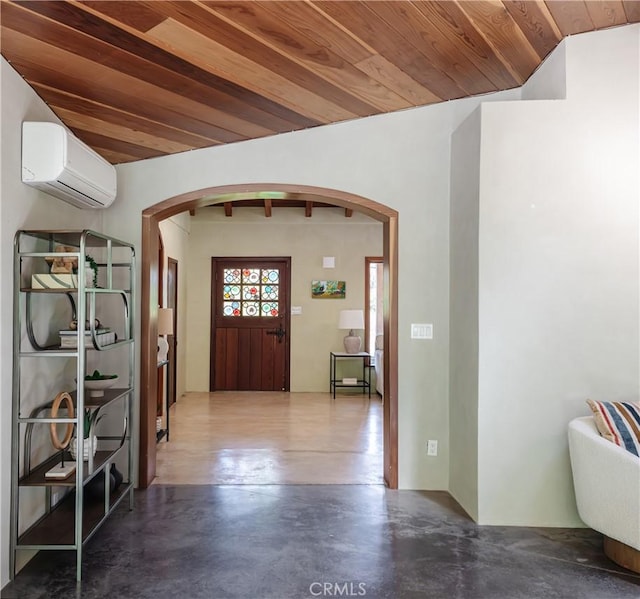 2 Chuckwagon Rd, Rolling Hills, CA 90274 - entryway with arched walkways, a wall mounted AC, concrete floors, and wood ceiling