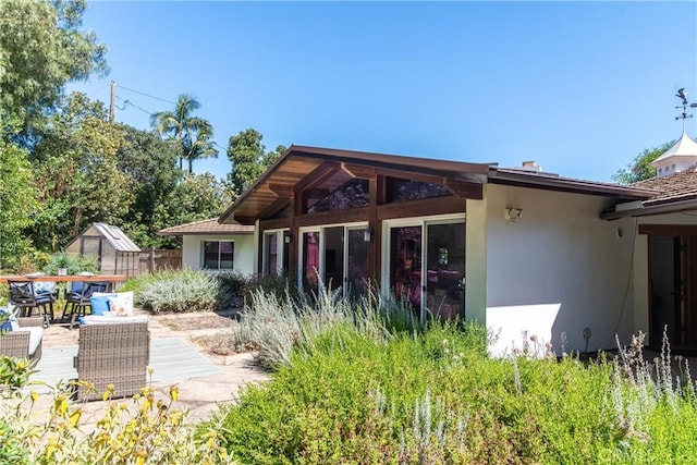 2 Chuckwagon Rd, Rolling Hills, CA 90274 - back of house with stucco siding and outdoor dining area