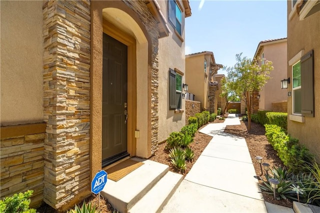 157 Ambrosia Ct, Perris, CA 92571 - view of exterior entry featuring stone siding and stucco siding