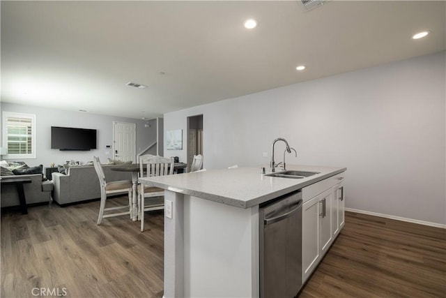 157 Ambrosia Ct, Perris, CA 92571 - kitchen with dishwasher, wood finished floors, white cabinetry, open floor plan, and a kitchen island with sink