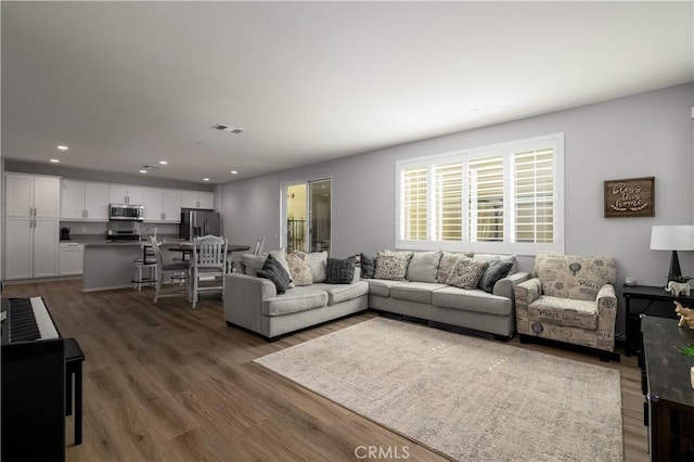 157 Ambrosia Ct, Perris, CA 92571 - living area featuring wood finished floors and recessed lighting