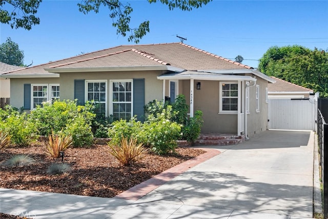 14348 Emelita St, Sherman Oaks, CA 91401 - bungalow-style house with stucco siding and driveway