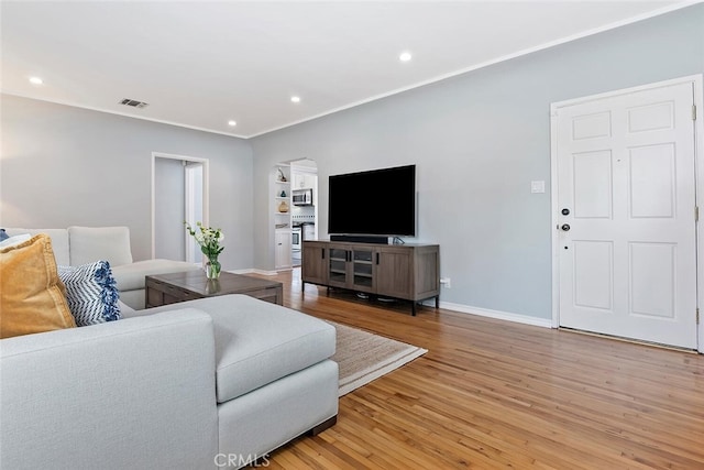 14348 Emelita St, Sherman Oaks, CA 91401 - living room featuring light wood finished floors, recessed lighting, and crown molding