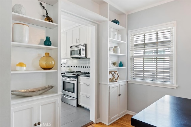 14348 Emelita St, Sherman Oaks, CA 91401 - kitchen featuring open shelves, stainless steel appliances, decorative backsplash, white cabinetry, and light wood finished floors