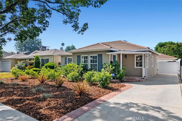 14348 Emelita St, Sherman Oaks, CA 91401 - single story home with stucco siding, a gate, and concrete driveway