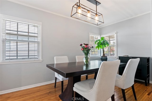 14348 Emelita St, Sherman Oaks, CA 91401 - dining room featuring a chandelier, wood finished floors, and ornamental molding