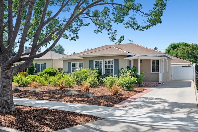 14348 Emelita St, Sherman Oaks, CA 91401 - ranch-style house with stucco siding, driveway, and a gate