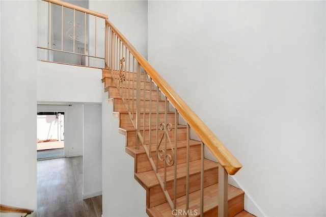 18931 Kittridge St Unit 73, Reseda, CA 91335 - staircase with wood finished floors and a high ceiling