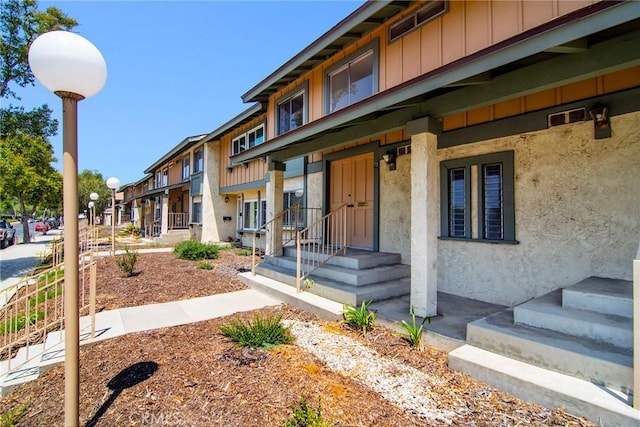 18931 Kittridge St Unit 73, Reseda, CA 91335 - property entrance featuring board and batten siding and stucco siding