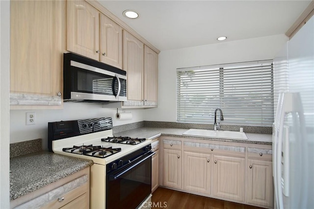 18931 Kittridge St Unit 73, Reseda, CA 91335 - kitchen featuring white gas range, stainless steel microwave, light brown cabinets, recessed lighting, and dark wood finished floors