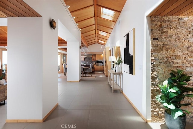 10551 Hillsboro Rd, North Tustin, CA 92705 - corridor featuring a skylight, tile patterned floors, and lofted ceiling