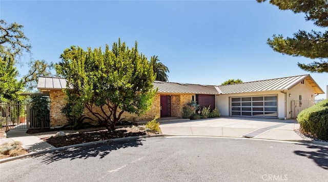 10551 Hillsboro Rd, North Tustin, CA 92705 - view of front of property with a standing seam roof, an attached garage, and a metal roof