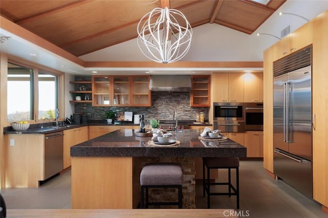 10551 Hillsboro Rd, North Tustin, CA 92705 - kitchen with stainless steel appliances, wall chimney exhaust hood, open shelves, backsplash, and a breakfast bar area