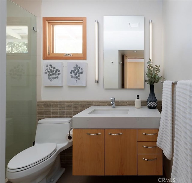 10551 Hillsboro Rd, North Tustin, CA 92705 - full bath featuring vanity, tile walls, a tile shower, and a wainscoted wall