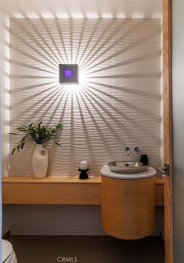 10551 Hillsboro Rd, North Tustin, CA 92705 - half bathroom with vanity and tile patterned floors