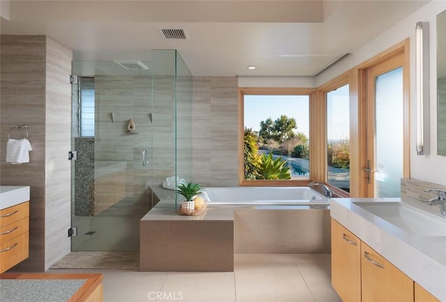 10551 Hillsboro Rd, North Tustin, CA 92705 - bathroom featuring vanity, a garden tub, a shower stall, tile patterned floors, and recessed lighting