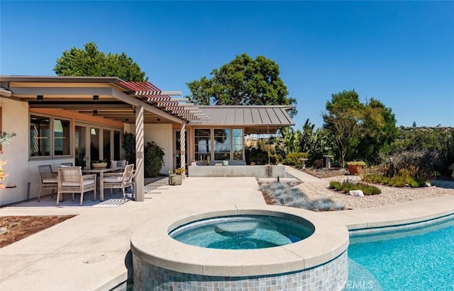 10551 Hillsboro Rd, North Tustin, CA 92705 - back of house featuring a patio area, stucco siding, a pool with connected hot tub, and outdoor dining space