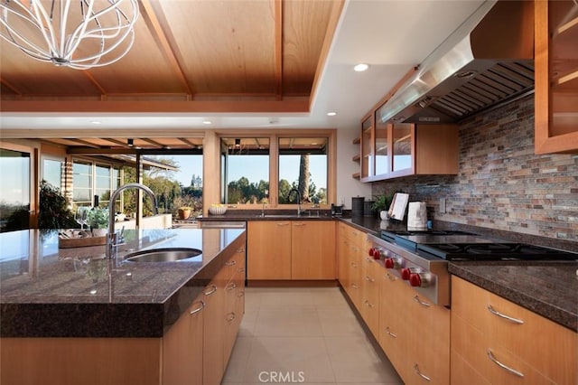10551 Hillsboro Rd, North Tustin, CA 92705 - kitchen featuring extractor fan, stainless steel gas stovetop, dark stone countertops, recessed lighting, and tasteful backsplash