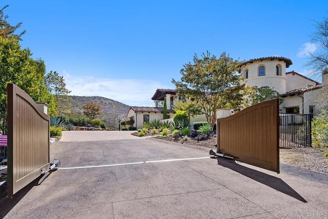 8183 Doug Hill, San Diego, CA 92127 - view of concrete surface with a gate and a mountain view