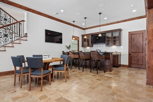 8183 Doug Hill, San Diego, CA 92127 - dining space featuring stone tile flooring, ornamental molding, stairway, bar with sink, and recessed lighting