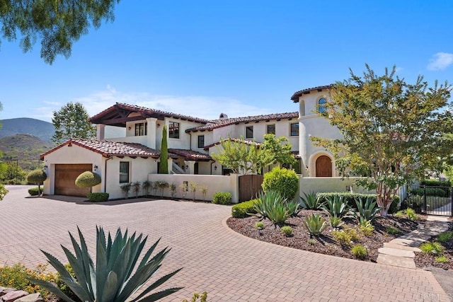 8183 Doug Hill, San Diego, CA 92127 - mediterranean / spanish-style home with a fenced front yard, decorative driveway, stucco siding, and a tiled roof