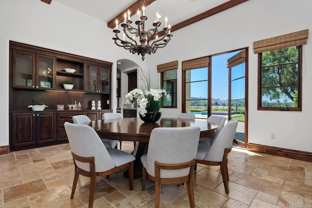 8183 Doug Hill, San Diego, CA 92127 - dining space featuring stone tile floors, a chandelier, and arched walkways