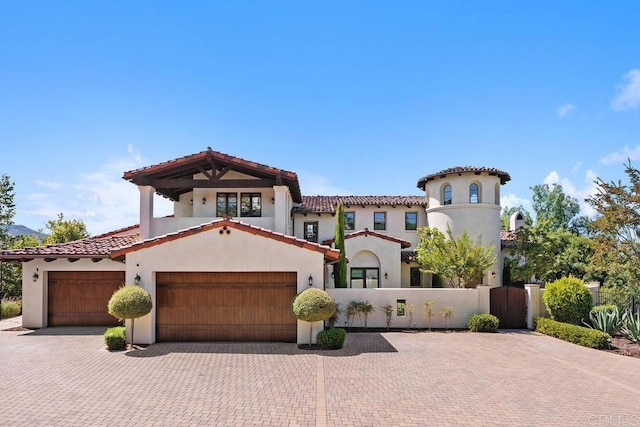 8183 Doug Hill, San Diego, CA 92127 - mediterranean / spanish house with stucco siding, a gate, decorative driveway, and a tiled roof