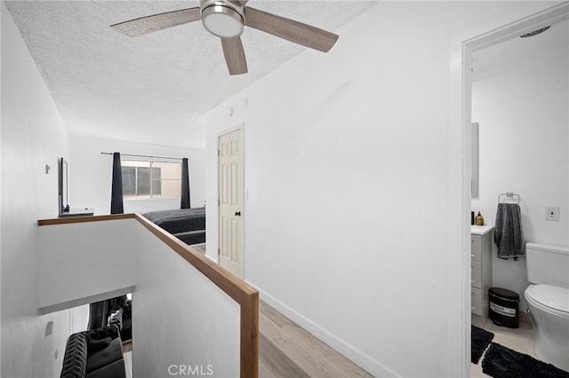 11025 Kittridge St Unit 128, North Hollywood, CA 91606 - hallway with a textured ceiling and wood finished floors
