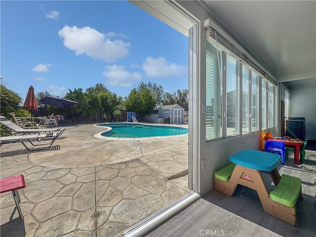 19891 Athenon Ave, Perris, CA 92570 - view of pool featuring a patio area and a storage shed