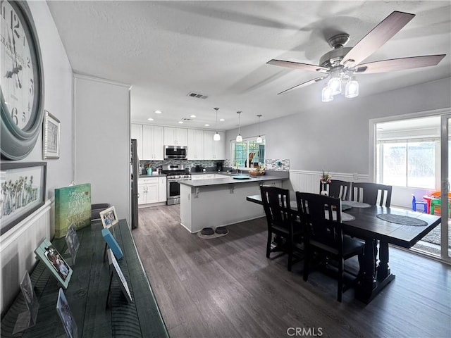 19891 Athenon Ave, Perris, CA 92570 - dining room with healthy amount of natural light, dark wood-style floors, a ceiling fan, and recessed lighting