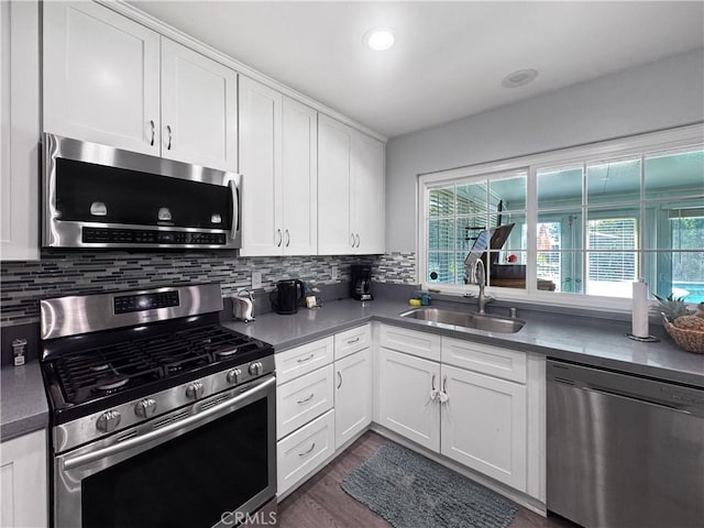 19891 Athenon Ave, Perris, CA 92570 - kitchen featuring appliances with stainless steel finishes, healthy amount of natural light, decorative backsplash, and white cabinets